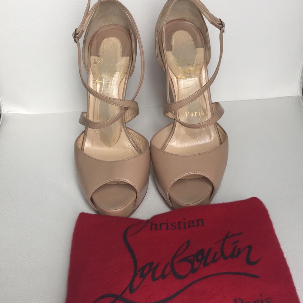 Louboutin nude peep toe stiletto.